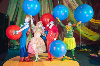 Moscow, Russia, May 16, 2015. Group of clowns on stage in the image. Theatrical clowning and Comedy make-up mass. The troupe of like-minded people was founded by Pavel Ivanov.