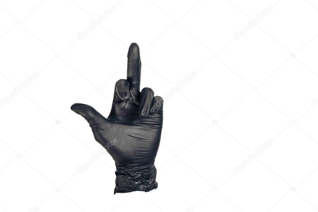 The hand in the black glove shows the middle finger raised up in a gesture fuck you . Close- up, isolated on a white background.