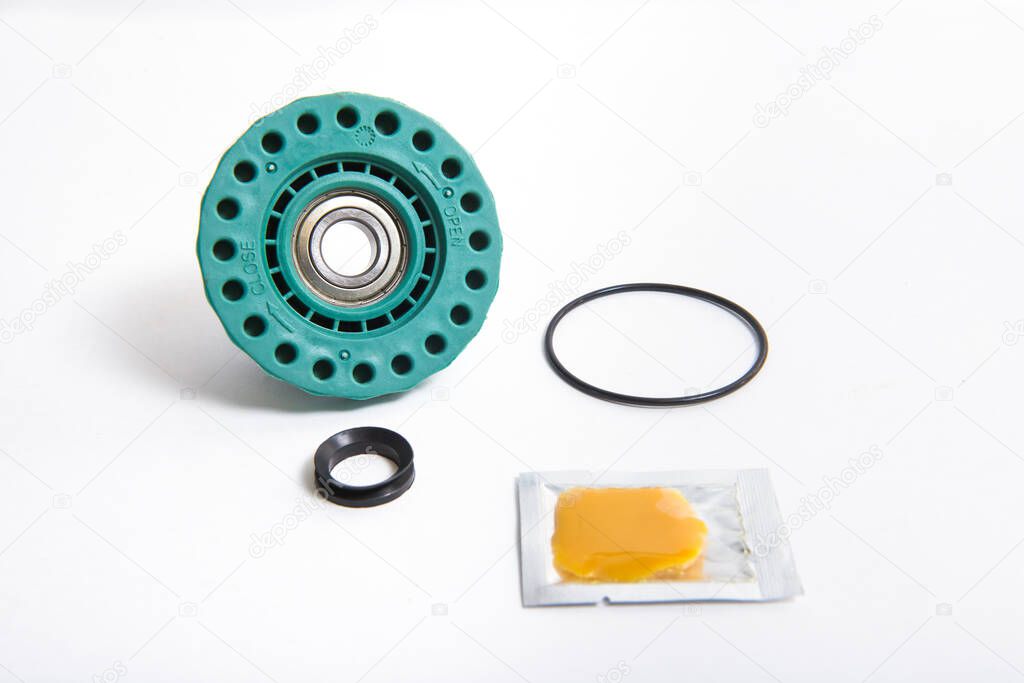 Repair kit of a caliper with a bearing an oil seal and a gasket for washing machines.
