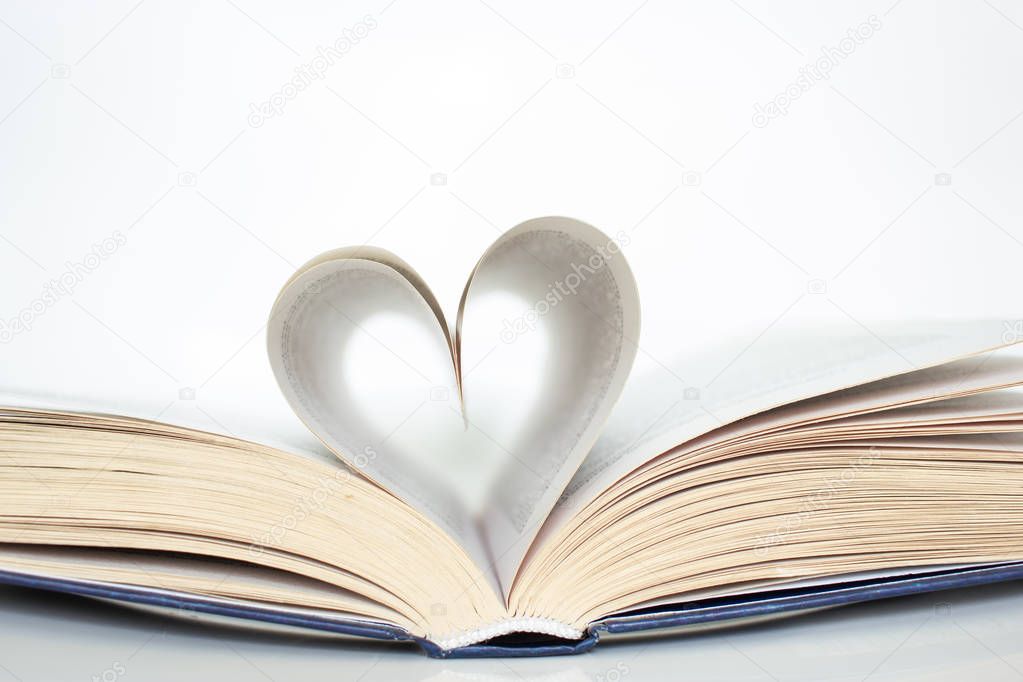 Book with love symbol isolated on white background