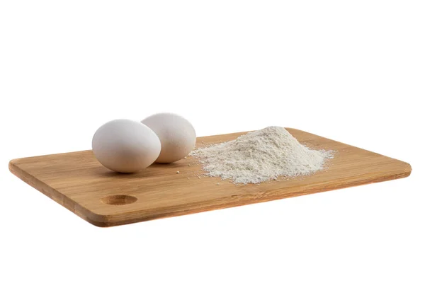 Δύο Άσπρα Αυγά Μια Ξύλινη Σανίδα Και Δίπλα Μια Χούφτα — Φωτογραφία Αρχείου