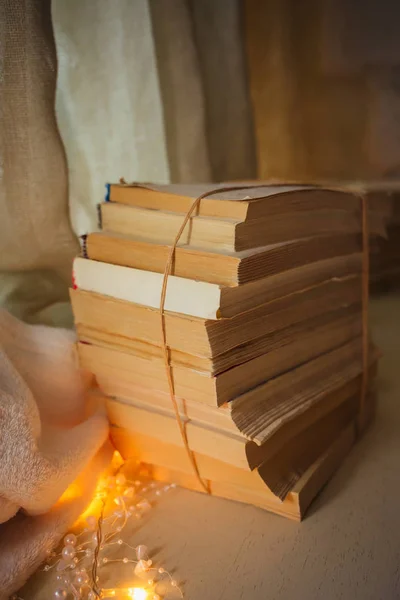 Stack of old vintage books tied with string lay — Stock Photo, Image