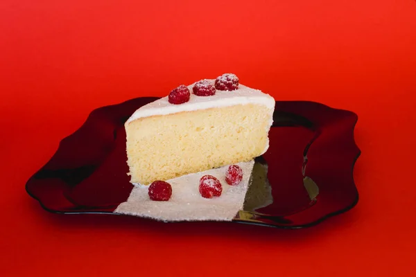 Raspberry Cheesecake isolated on red