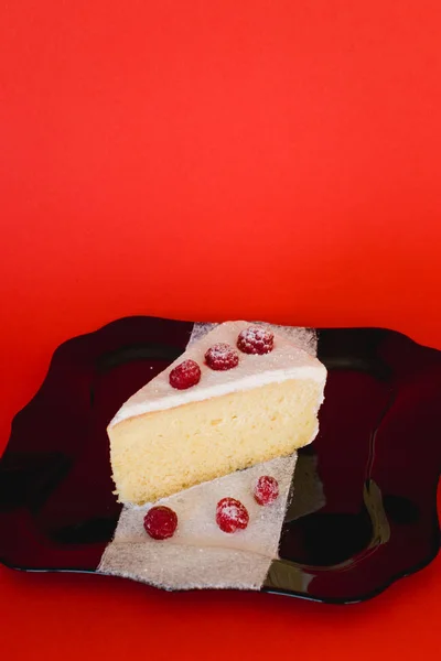 Raspberry Cheesecake isolated on red