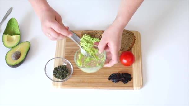 Girl Makes Sandwich Avocado Sandwich Avocado White Table Close Healthy — Stock Video