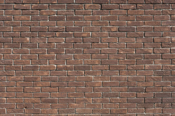 Empty red brick wall textured background. Close-up