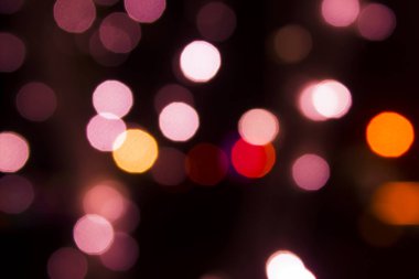 siyah arka planda, soyut renkli ışık bokeh.