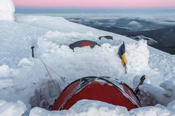 two tents in snow on mountain at early morning, Carpathian Mountains, Ukraine