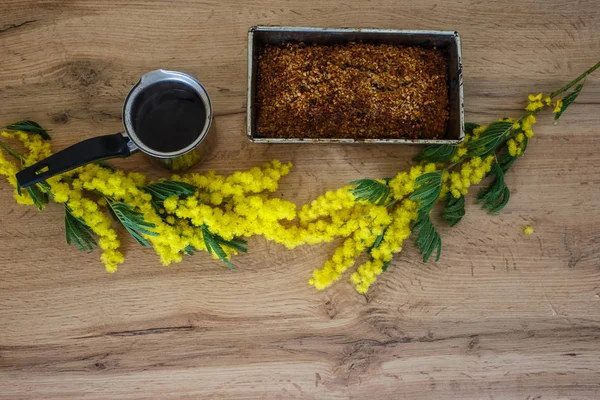 Coffee with homemade cakes and flowers flat lay