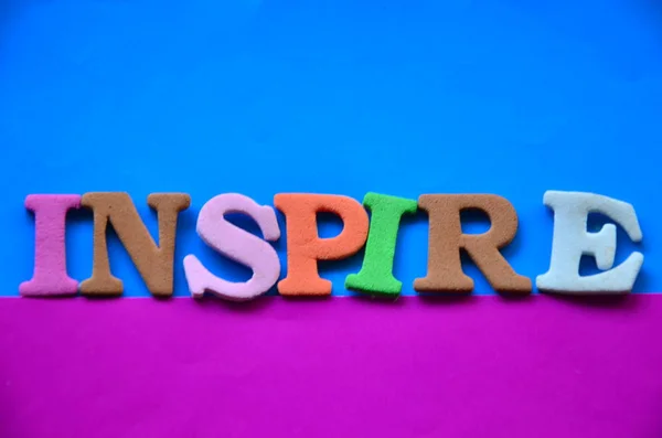 Palabra inspirar en un resumen — Foto de Stock