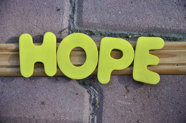 Ordet hopp på ett abstrakt — Stockfoto