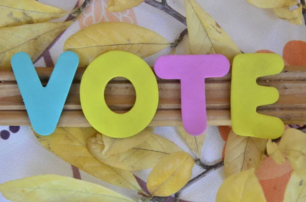 The word vote on a  abstract — Stock Photo, Image