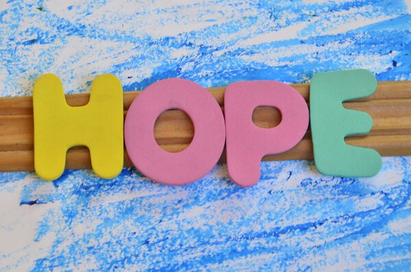 word hope on an  abstract colored background