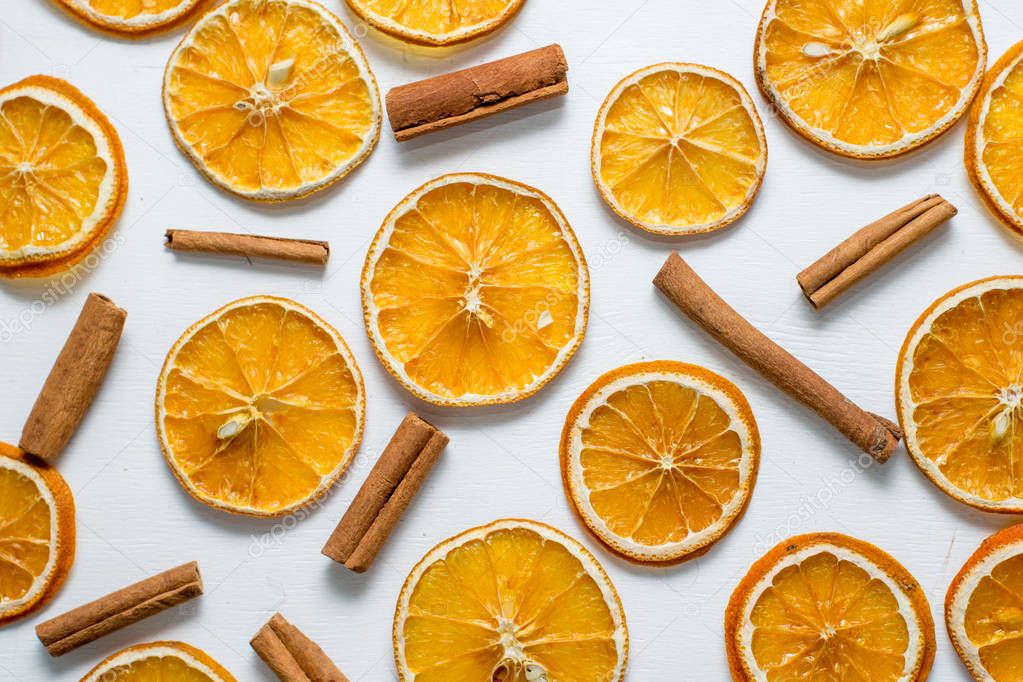 Dried oranges with cinnamon and anise, isolated on white background
