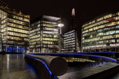 London, UK - Jan 2020: The Shard and The Scoop on a dark wet night