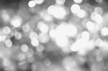 Gümüş ve beyaz bokeh ışıkları söndü. soyut arkaplan