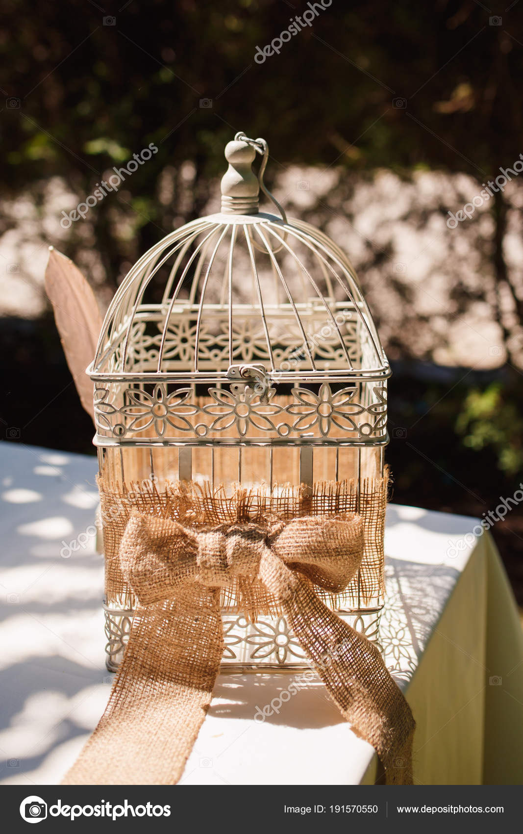 Vintage Bird Cage Decorated With Wreath Made Of Rustic Ribbon With