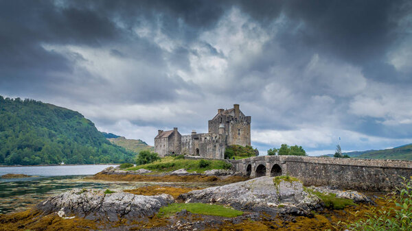Eilean Donan Castle, Loch Duich, Scotish highlands, United Kingdom with a cloudy dramatic sky