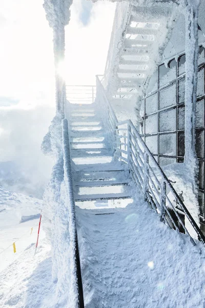 Snow and ice covered stairs and windows at top of mountain Chopok — Stock Photo, Image