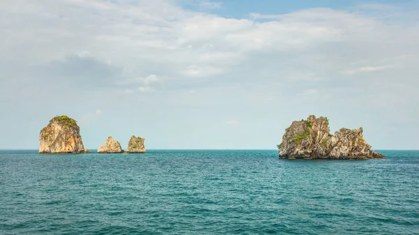 Four of hundreds small uninhabited karst rocky islands — Stock Photo, Image