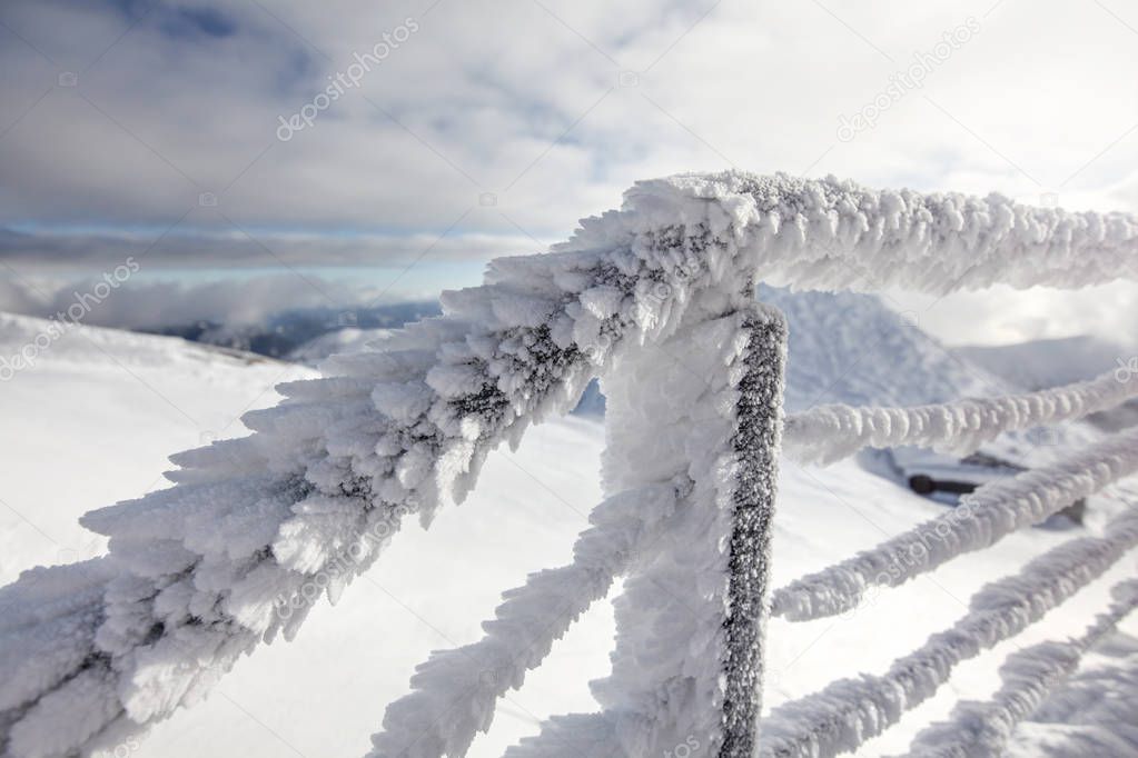 Snow and ice covered stairs fence illustrating extreme cold 