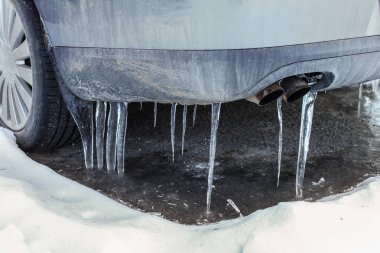 Icicles on exhaust of dirty car that was not used for some time, clipart