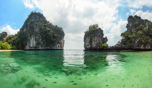 Panorama of sharp karst cliffs rising from water with clear gree — Stock Photo, Image
