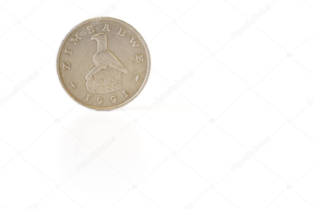 Zimbabwe coin rear side, with bateleur eagle, closeup detail isolated on white background