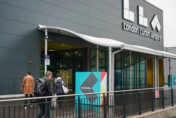 London, United Kingdom - February 05, 2019: Passengers entering departure hall of Luton airport on overcast day. LTN is 5th busiest in United Kingdom.