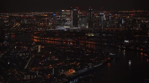 Aerial view of London at night, north eastern part, Isle of Dogs on river Thames, with Canary Wharf financial district. — Stock Video