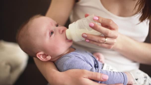 Mother Holding Months Old Infant Boy Feeding Him Milk Bottle — Stock Video