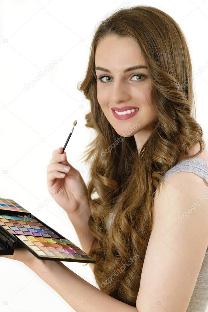 Beautiful Young Woman Applying Eyeshadow