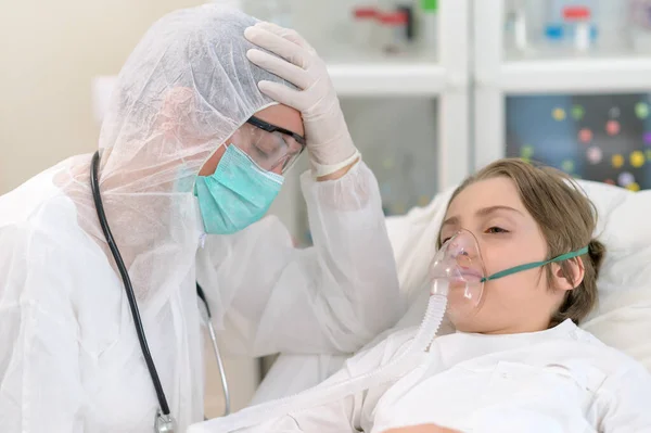 Empathic Tired Doctor Taking Care Kid Treating Intubating Him — Stock Photo, Image