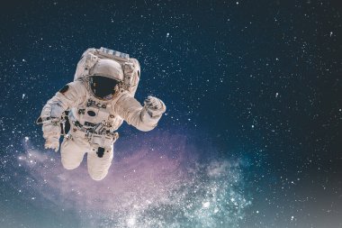 Dünya 'nın dış uzayındaki astronot güneş ışığıyla. Gezegenin şehir ışıkları. Bu görüntünün elementleri NASA tarafından desteklenmektedir.
