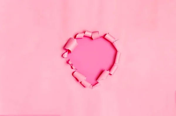 Heart Shaped Purple Hole Torn Paper Isolated Pink Background Torn — ストック写真