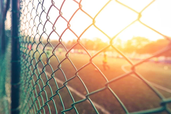 fence and sunset light in sport club
