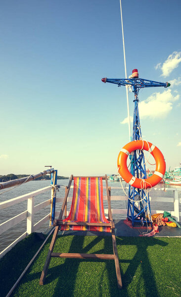 beach chair on boat terrace for sunbathe midday.