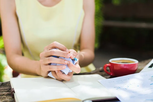 A businesswomen Crumpled up papers by hand. Fail, bad, no idea concept.