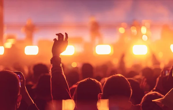 crowd with raised hands at concert festival
