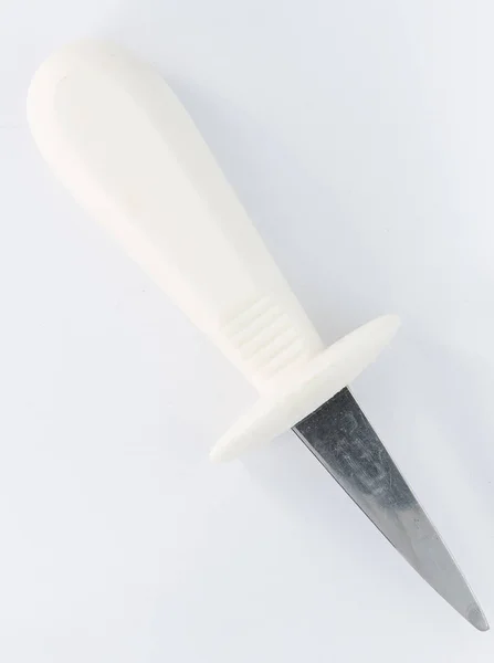 A different knife with white plastic handle — Stock Photo, Image
