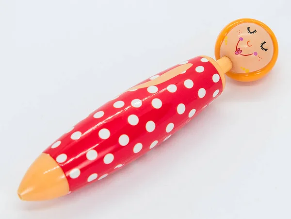 Red pen with doll face perfect for school — Stock Photo, Image