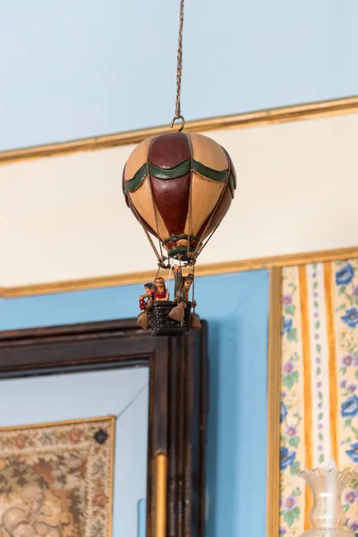 Photo of a toy balloon hanging from the ceiling — Stock Photo, Image