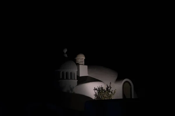 Night photograph of a typical Arabian white house