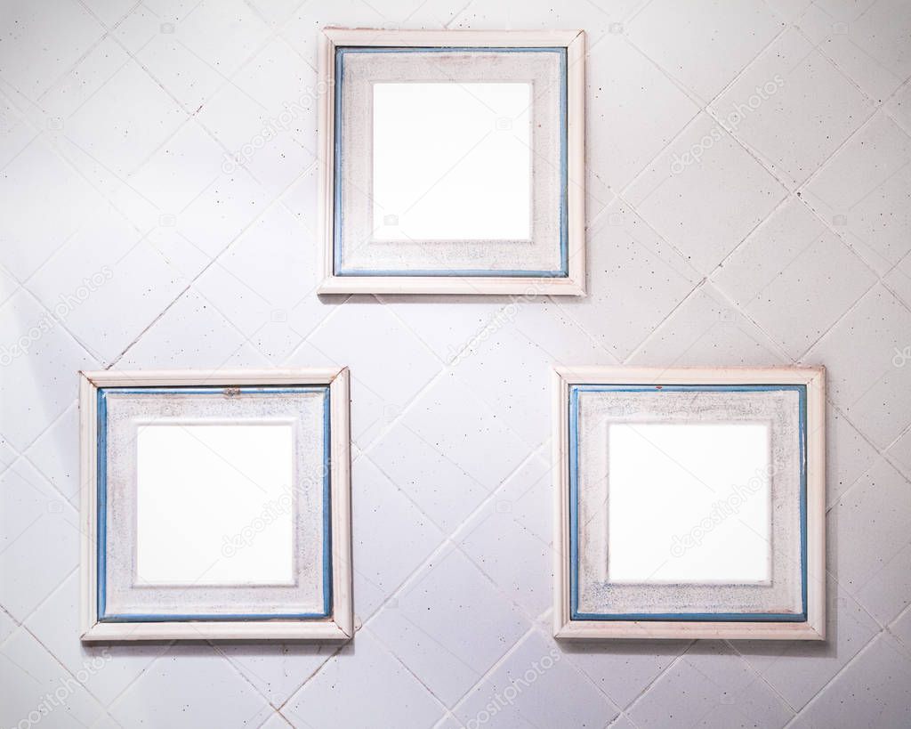 Terracotta frames on Tile wall