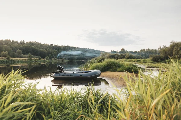 Inflatable boat and fishing tackle. — Stock Photo, Image