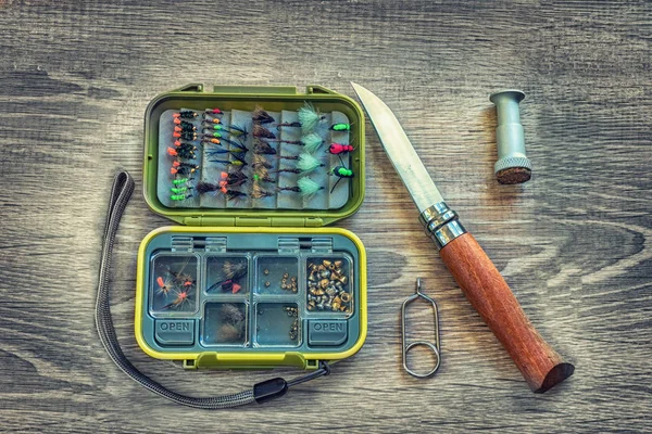 Fishing accessories on a background of wood — ストック写真