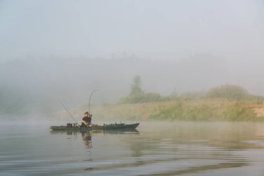 Fishing on the kayak. Spinning fishing.