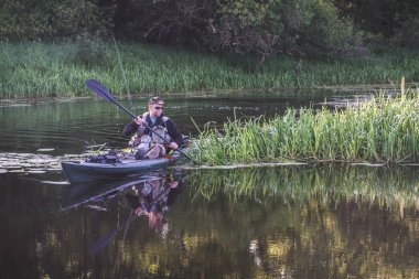 Fishing on the kayak. Spinning fishing.