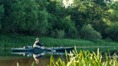 Fishing on the kayak. Spinning fishing.