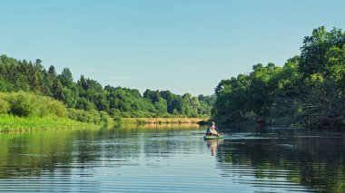 Fishing on the kayak. Spinning fishing.